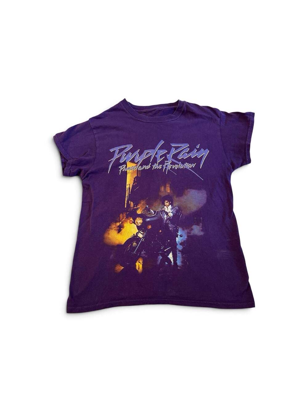 Pre loved Prince shirt size small.  Slight bleach stain on back.